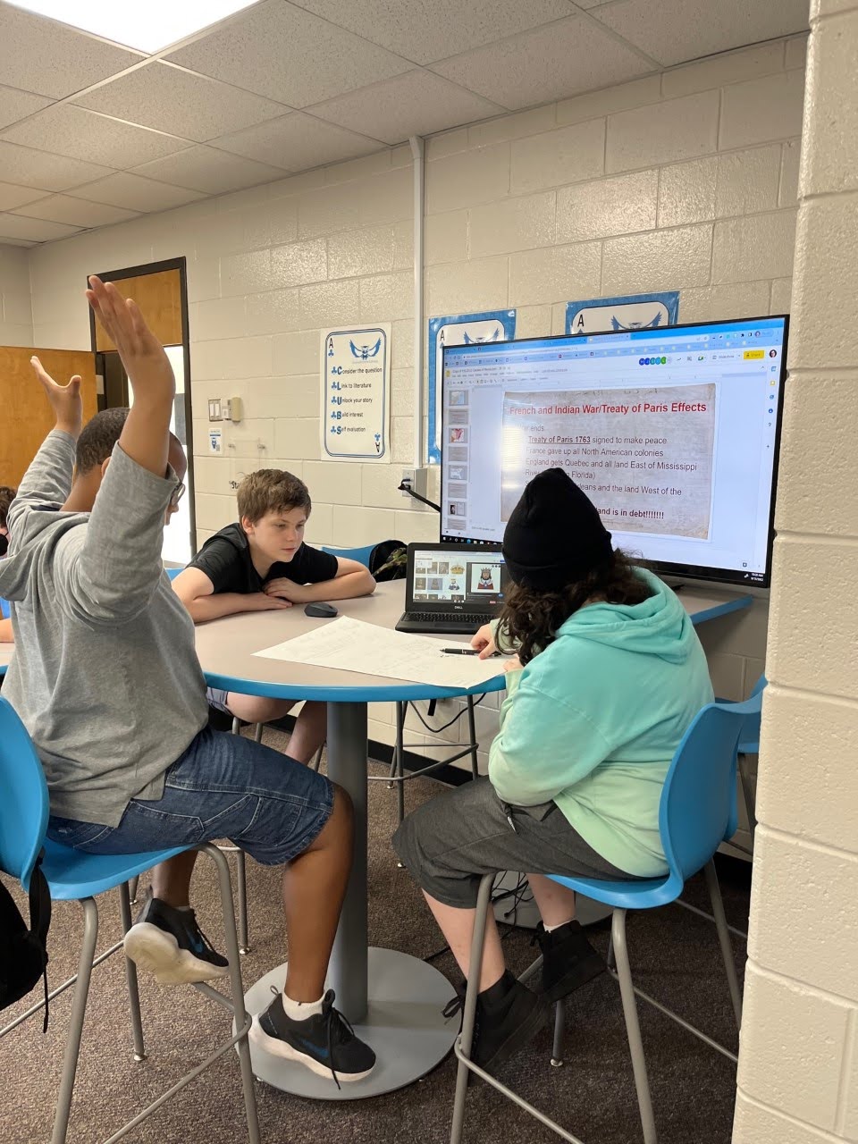 Ms. Hogan helps a student in the science lab 
